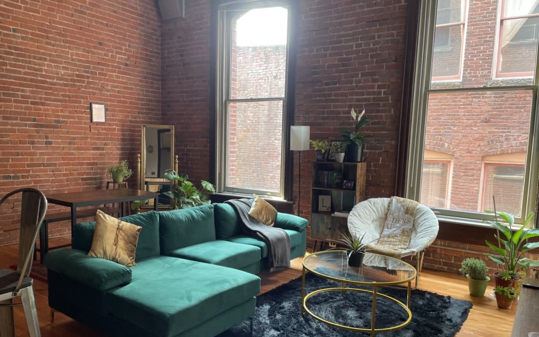This Rental Has a Great Green Sofa Against Envy-Inducing Exposed Brick Walls