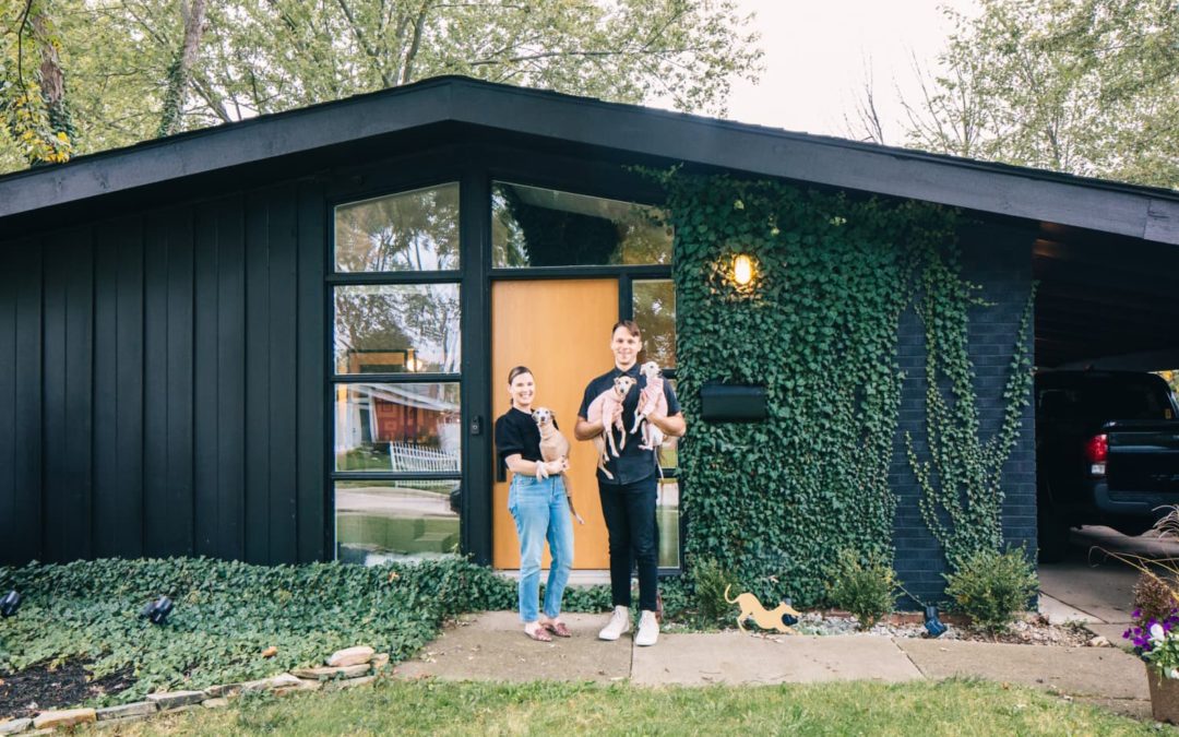 A 1959 Michigan MCM House Has a Stunning Wall of Shelves & All-Black Kitchen