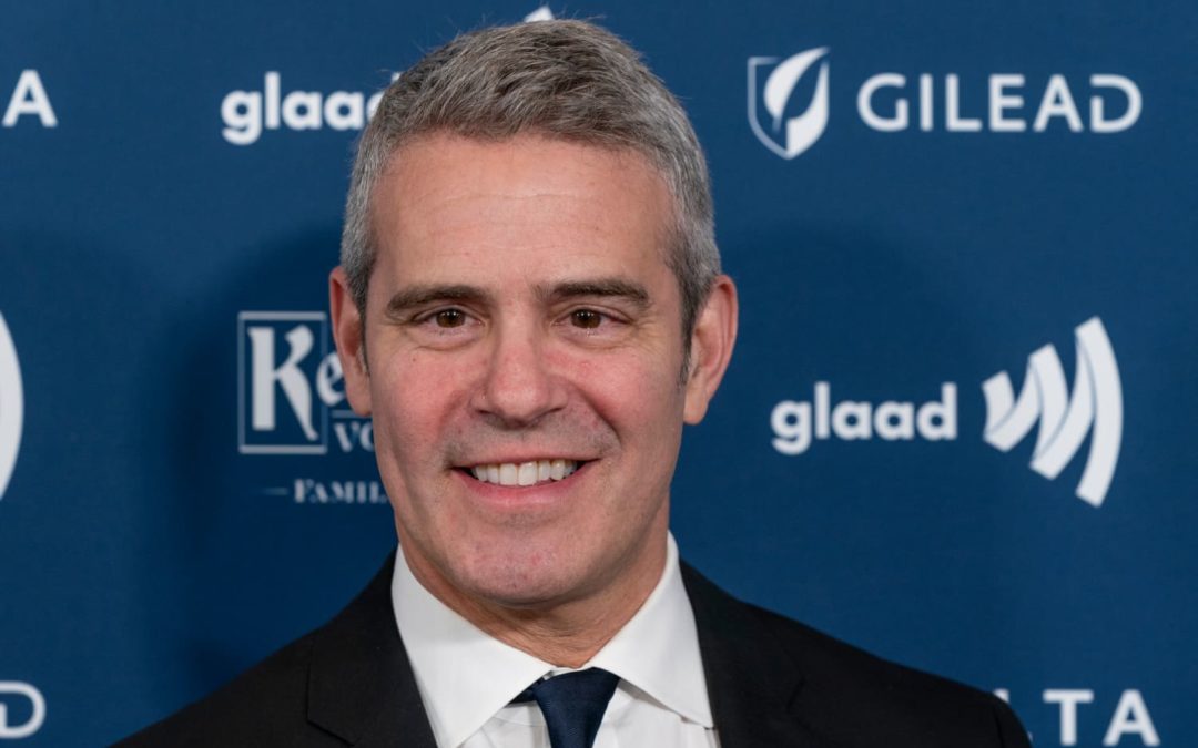 Andy Cohen’s Gray and Yellow Plaid Couch Is a Burst of Playfulness